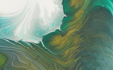 art photography of abstract marbleized effect background. emerald green, white and gold creative...