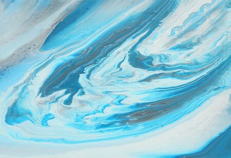 art photography of abstract marbleized effect background. turquoise, blue and white creative colors....