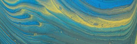 art photography of abstract marbleized effect background. blue and gold creative colors. Beautiful...