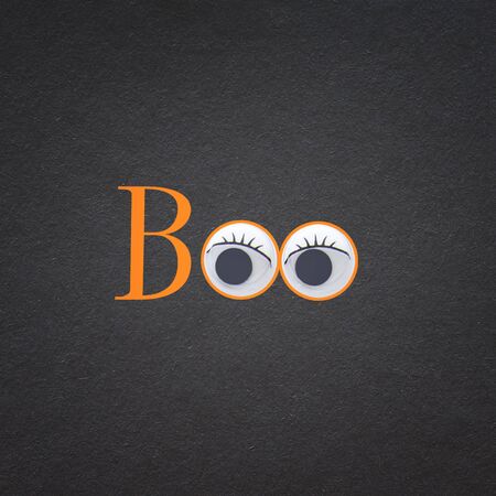 holidays Halloween concept. Word BOO over black background. Top view, flat layの写真素材