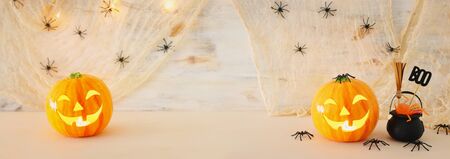 holidays halloween concept image. Pumpkin, spiders over wooden tableの写真素材