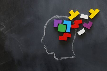 medical concept of Brain made from wooden puzzle into human head. idea of thinking, workflow, adhd...