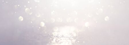 abstract backgrounf of glitter vintage lights . silver and white. de-focused. bannerの写真素材