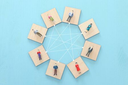 business concept image of people figures over wooden table, human resources and management conceptの写真素材