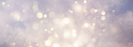 abstract backgrounf of glitter vintage lights . silver and white. de-focused. bannerの写真素材