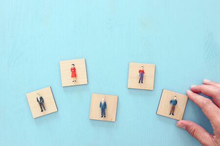 business concept image of people figures over wooden table, human resources and management conceptの写真素材