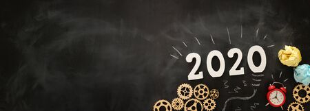 Business concept, top view of blackboard with the phrase 2020