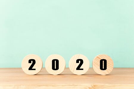 New year 2020 concept. business idea over wooden board