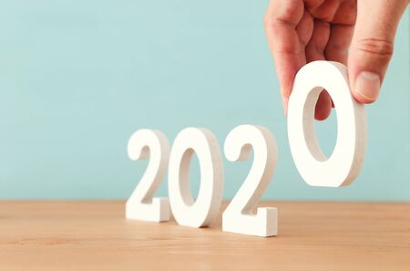 New year 2020 concept. business idea over wooden boardの写真素材