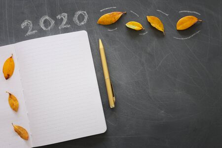 Business concept, top view of blackboard with the phrase 2020 goals