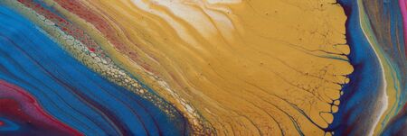 art photography of abstract marbleized effect background. blue and gold creative colors. Beautiful...