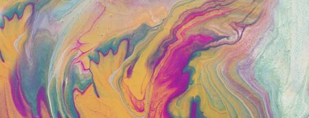 art photography of abstract marbleized effect background. pink, purple, gold and blue creative...