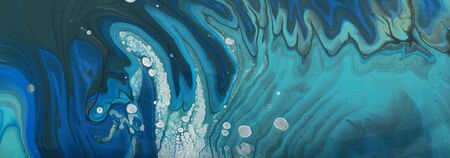 art photography of abstract marbleized effect background. blue, turquoise and black creative colors....