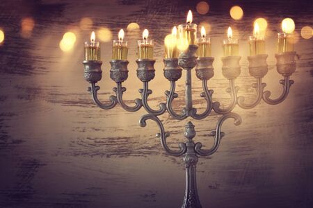 Religion image of jewish holiday Hanukkah background with menorah (traditional candelabra) and oil candlesの写真素材
