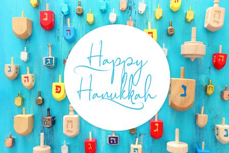 religion concept of jewish holiday Hanukkah with dreidels colection (spinning top) over blue backgroundの写真素材