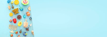 religion image of jewish holiday Hanukkah background with menorah (traditional candelabra) and spinning topの写真素材