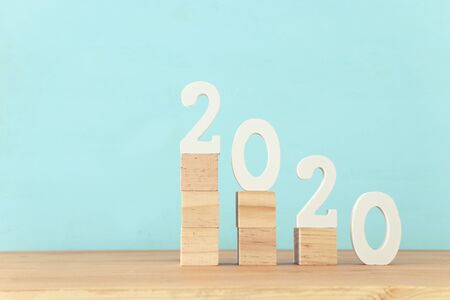 New year 2020 concept. business idea over wooden board