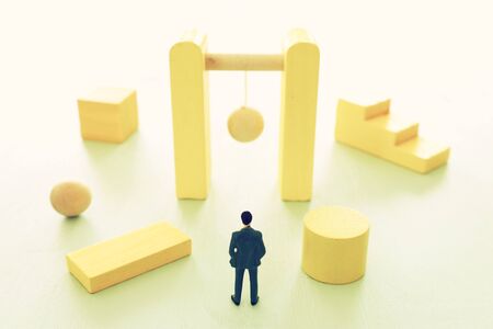 Business concept of problem solving and learning strategy. A businessman faces a challenge that needs to be solved in the most efficient wayの写真素材
