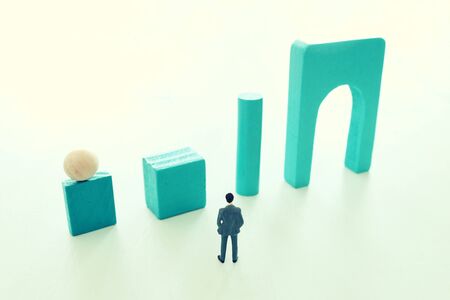 Business concept of problem solving and learning strategy. A businessman faces a challenge that...