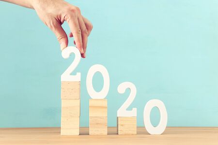 New year 2020 concept. business idea over wooden boardの写真素材