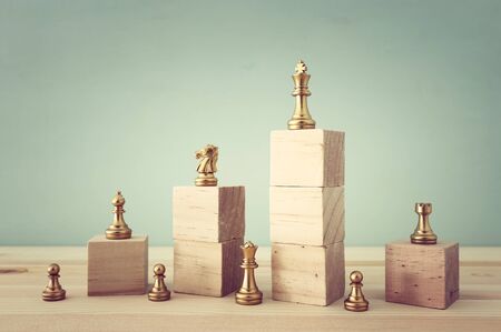 business concept image of chess figures over wooden table, human resources and management conceptの写真素材