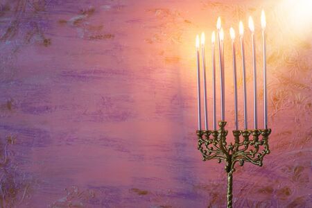 Religion image of jewish holiday Hanukkah background with menorah (traditional candelabra) and...