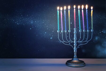 Religion image of jewish holiday Hanukkah background with menorah (traditional candelabra) and...