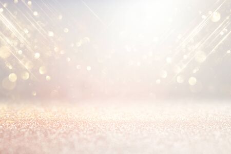 abstract background of glitter vintage lights . silver, gold and white. de-focusedの写真素材