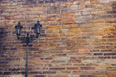 Background of old brick wall and street lanternの写真素材