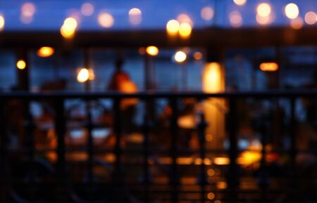 abstract background of colorful blurred defocused bokeh street lights. motion and nightlife concept.の写真素材