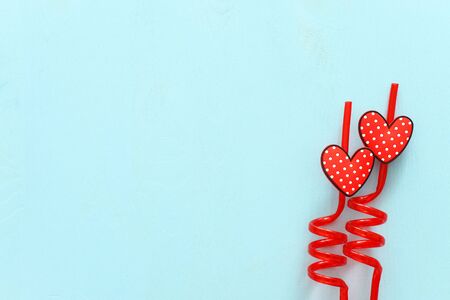 Valentines day concept. red hearts over wooden blue background. Flat lay compositionの写真素材
