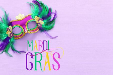 Holidays image of mardi gras masquarade venetian mask over purple background. view from aboveの写真素材