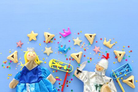 Purim celebration concept (jewish carnival holiday) over blue wooden background. Top view, Flat layの写真素材