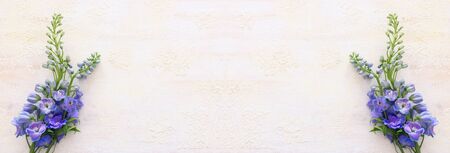 spring bouquet of blue flowers over white vintage wooden background. top view, flat layの写真素材