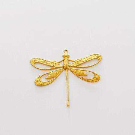 Brass gold vintage Baroque Victorian filigree jewellery pedant isolated on whiteの写真素材