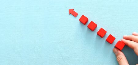 Business leaBusiness leadership concept, red arrow leader with group of followersdership concept,...