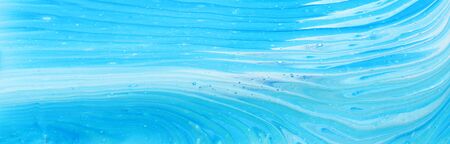 art photography of abstract marbleized effect background. Blue and white creative colors. Beautiful...