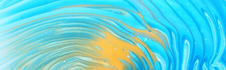 art photography of abstract marbleized effect background. Blue, white and gold creative colors....