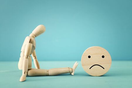 concept image of wooden dummy with worried stressed thoughts. depression, obsessive compulsive,...