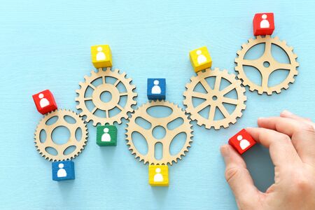 image of colorful blocks with people icons over wooden table ,human resources and management conceptの写真素材