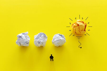 Education concept image. Creative idea and innovation. Crumpled paper as light bulb metaphorの写真素材