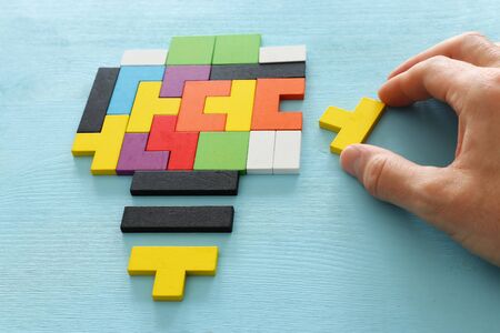 Inspiration concept puzzle shaped as light bulb metaphor . finding the right idea