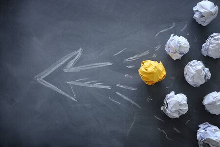 Education concept image. Creative idea and innovation. Crumpled paper as light bulb metaphor over...