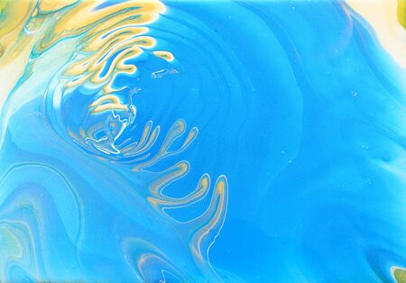 art photography of abstract marbleized effect background. Blue, gold and white creative colors....