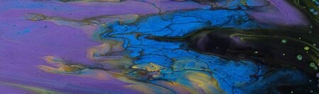art photography of abstract marbleized effect background. Black, blue, gold, yellow and purple...