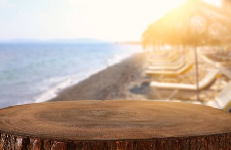 background Image of wooden table in front of tropical beach. Ready for product displayの写真素材