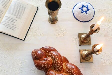 shabbat image. challah bread, shabbat wine and candles. Top viewの写真素材