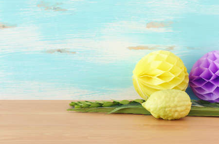Jewish festival of Sukkot. Traditional symbols (The four species): Etrog (citron), lulav (palm...