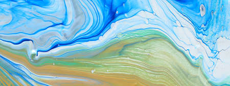 art photography of abstract marbleized effect background. Blue, white and gold creative colors. Beautiful paint.の写真素材