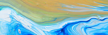 art photography of abstract marbleized effect background. Blue, white and gold creative colors. Beautiful paint.の写真素材